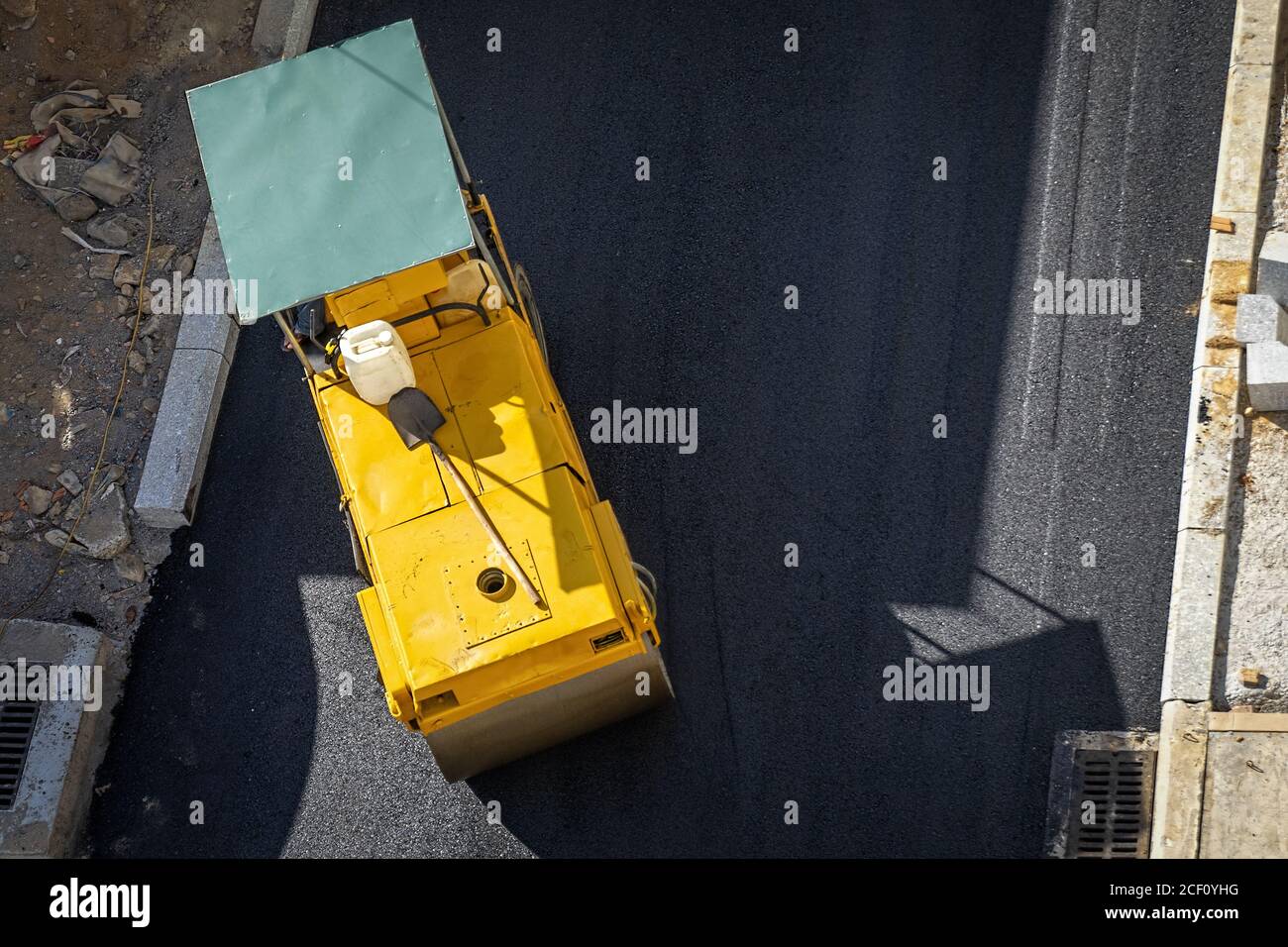 Compacting asphalt with Steel Wheel Roller. Scheduled repair of asphalt ...