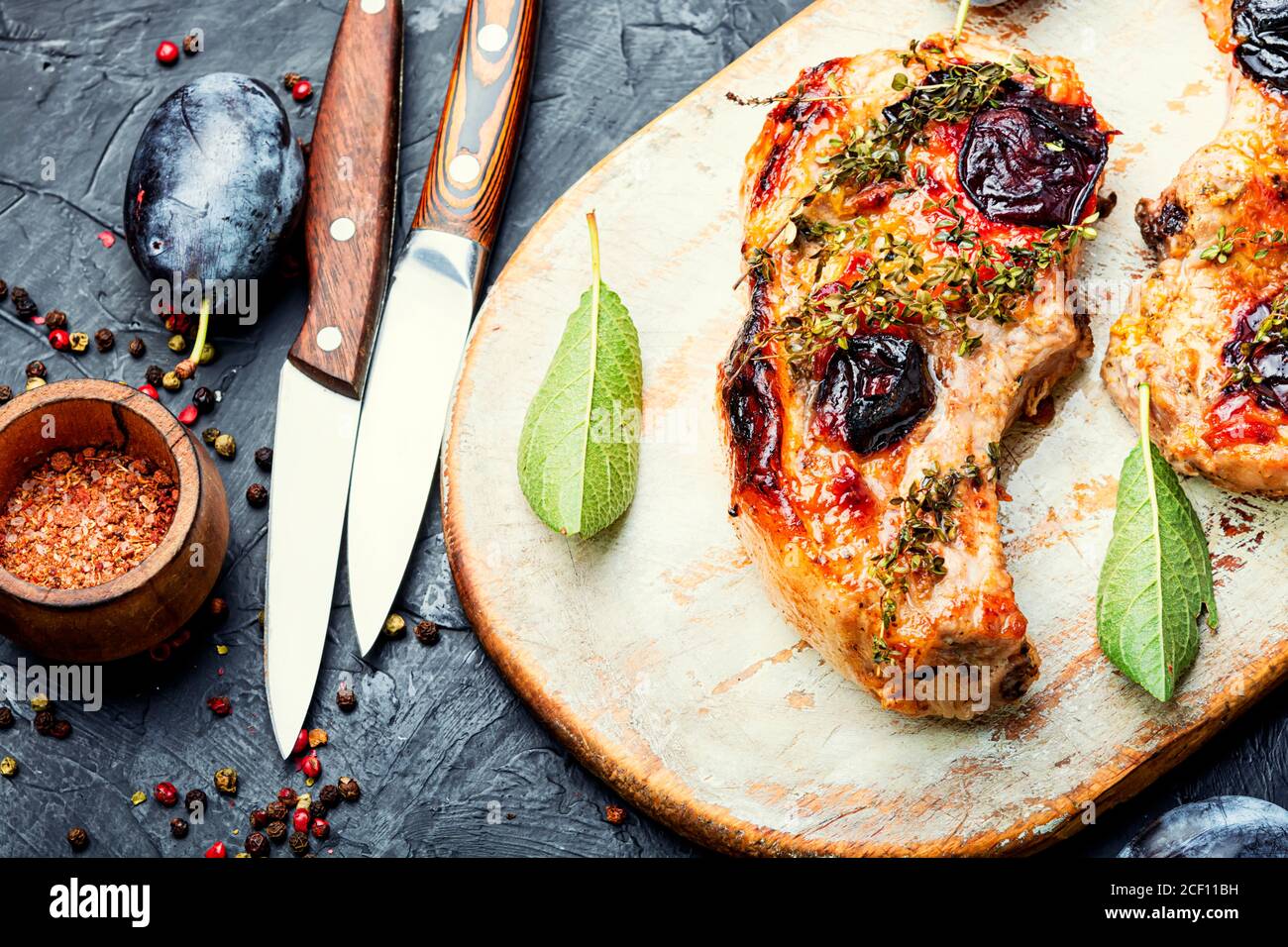Appetizing pork steak cooked in plum sauce Stock Photo