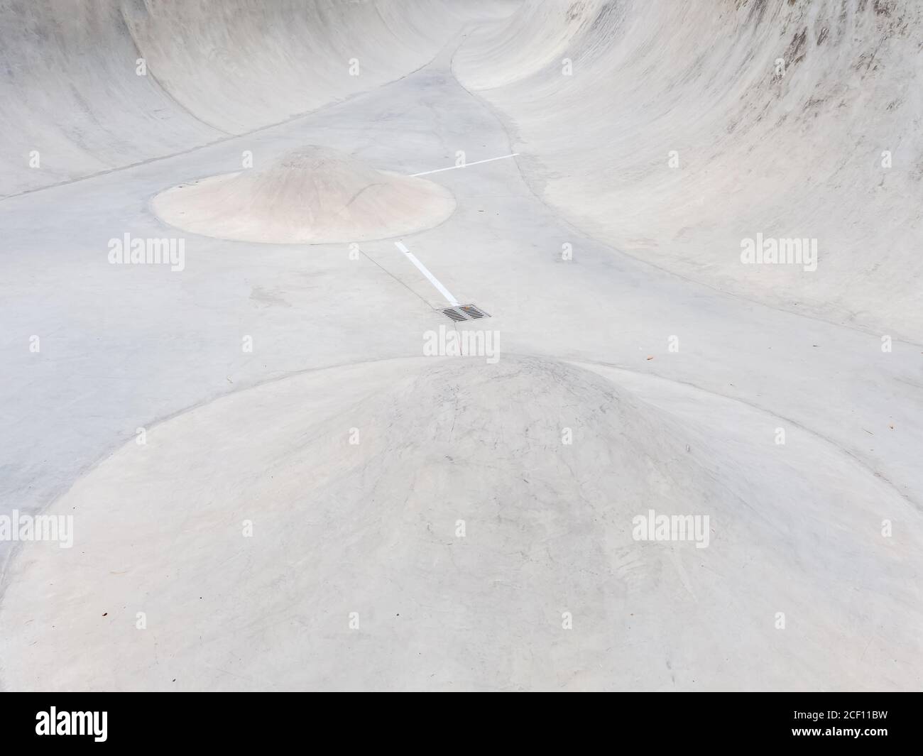 Concrete skate park with ramps and cone barriers Stock Photo - Alamy