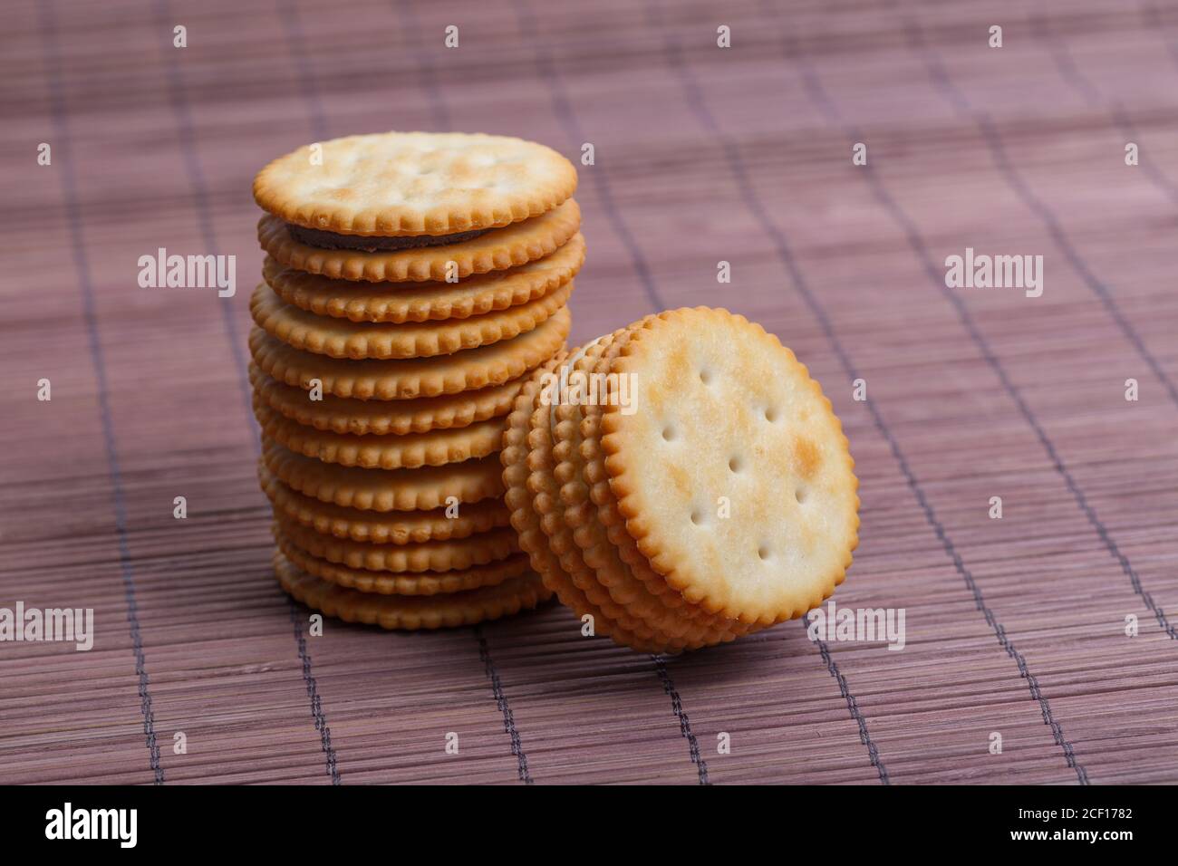Cream sandwich biscuits on bamboo curtain background Stock Photo