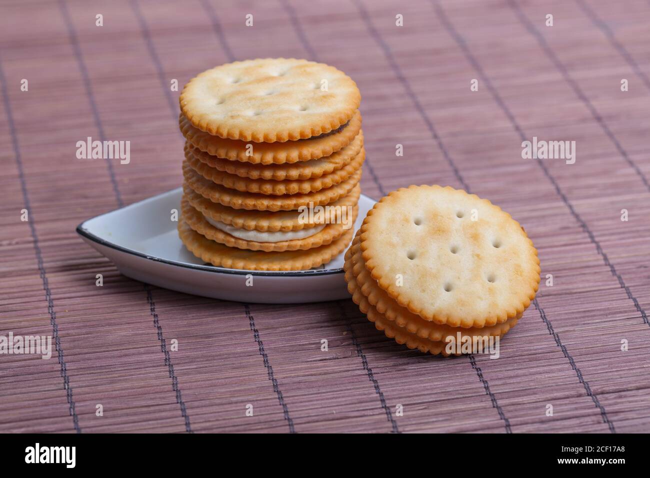 Cream sandwich biscuits on bamboo curtain background Stock Photo