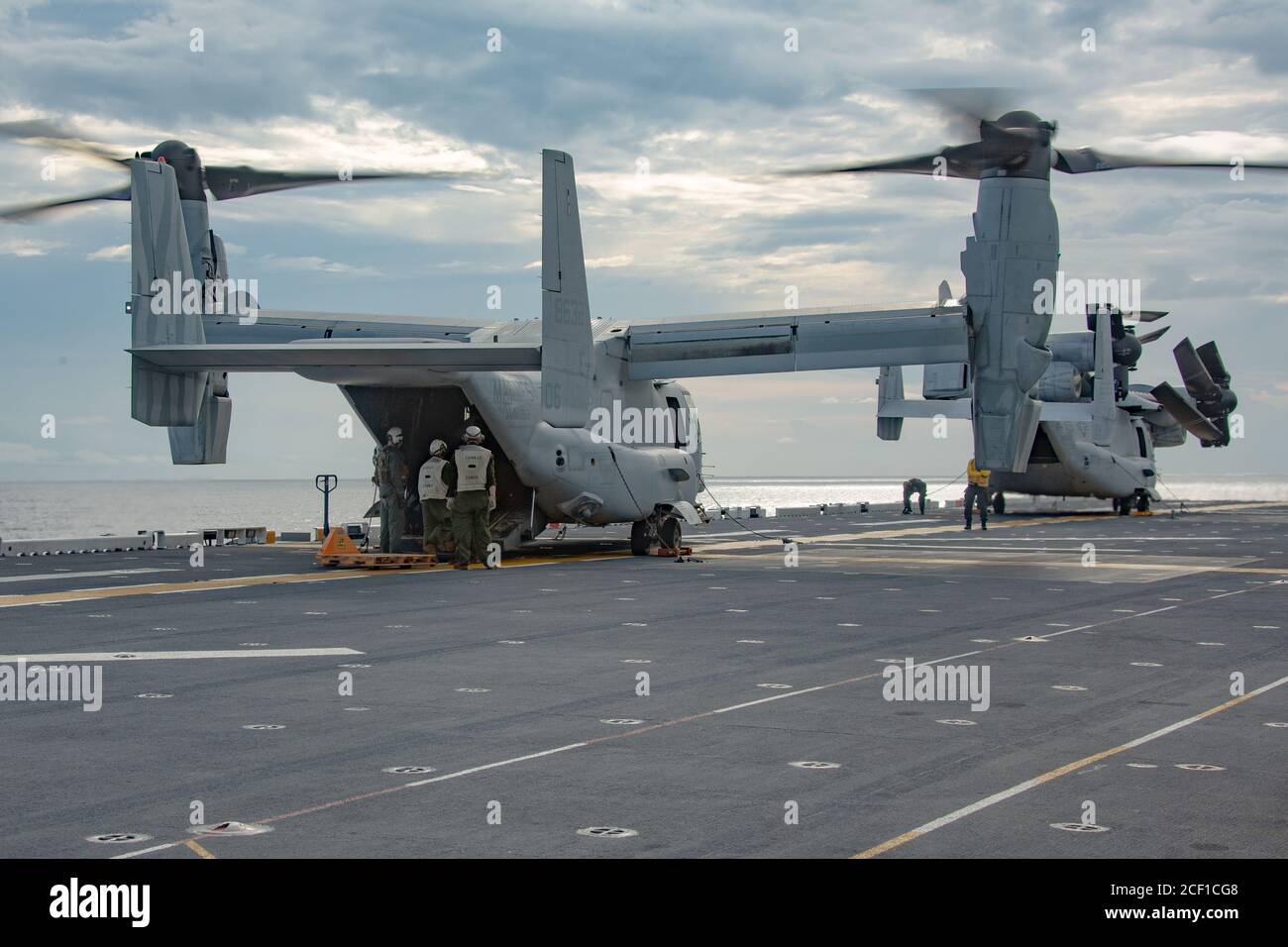 PHILIPPINE SEA (Sep. 2, 2020) Marines with the Forward Command Element (FCE), 31st Marine Expeditionary Unit (MEU), board a MV-22B Osprey with Marine Medium Tiltrotor Squadron 262 (Reinforced) for an embassy reinforcement drill, aboard amphibious assault ship USS America (LHA 6). The FCE is prepared to deploy to U.S. embassies in the region in order to establish communication and coordination with the MEU for follow on missions. The America, flagship of the America Amphibious Ready Group, 31st MEU team, is operating in the U.S. 7th Fleet area of operations to enhance interoperability with alli Stock Photo