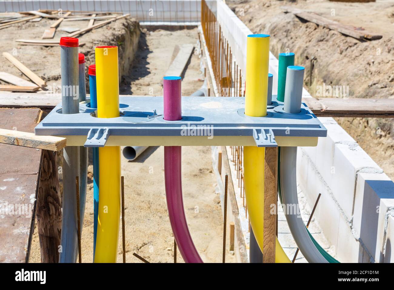 Foundation of new house with pipes on construction site Stock Photo