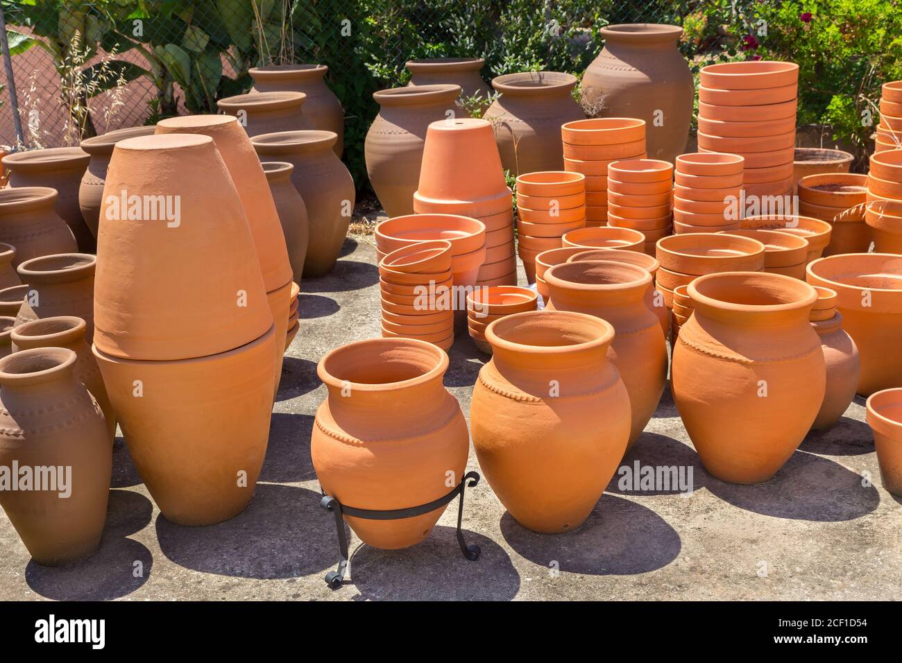 Many big orange clay vases outdoors at portuguese pottery shop Stock Photo