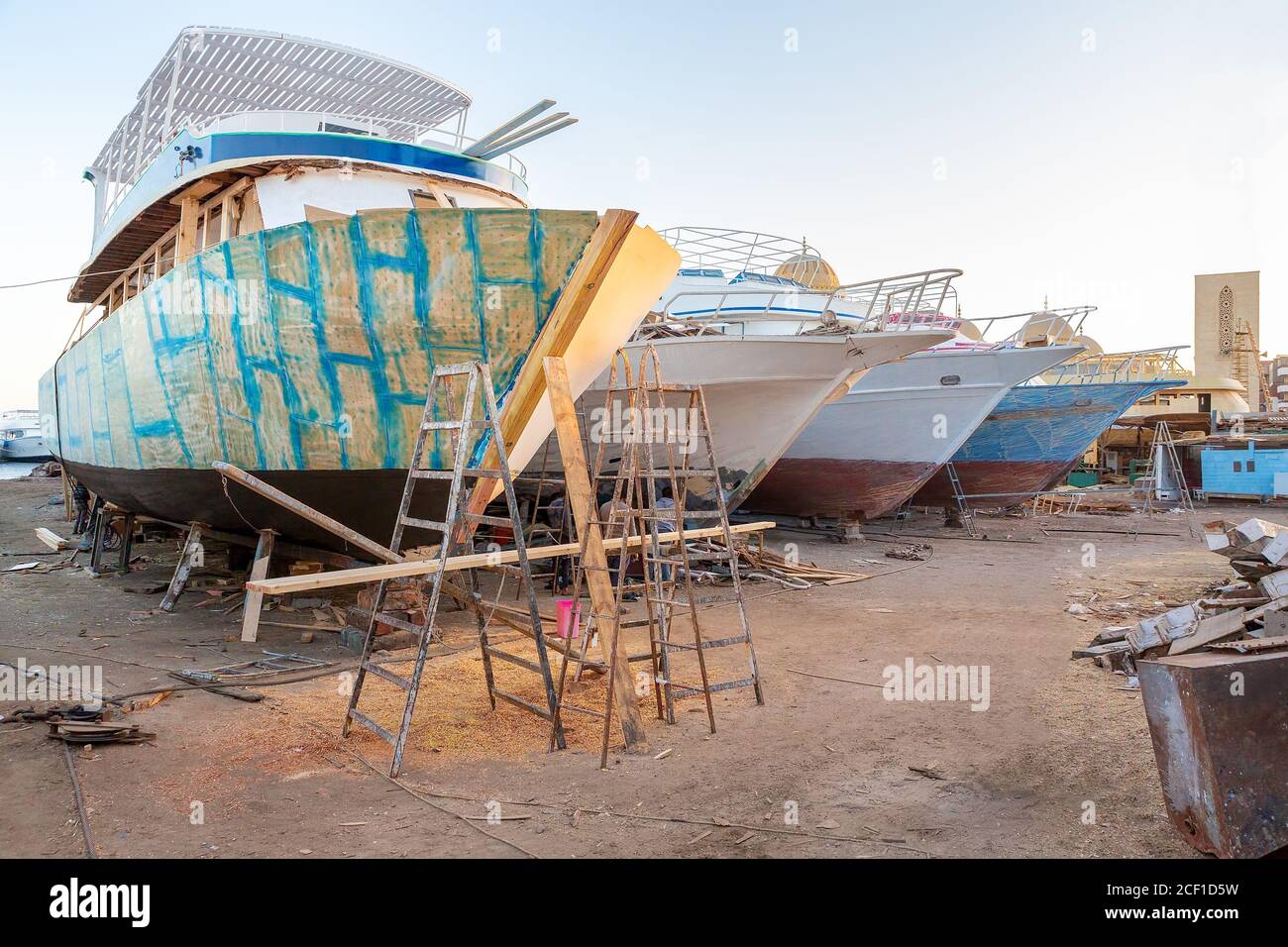Group of pleasure boats under construction at shipyard in city Hurghada Egypt Stock Photo