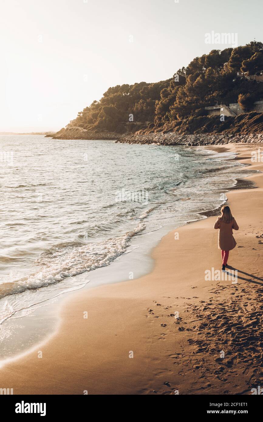 Woman looking wavy ocean hi-res stock photography and images - Alamy
