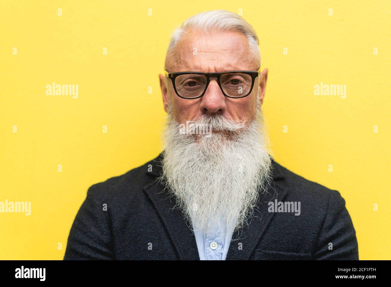 Close up of hipster senior bearded serious man Mature fashion and