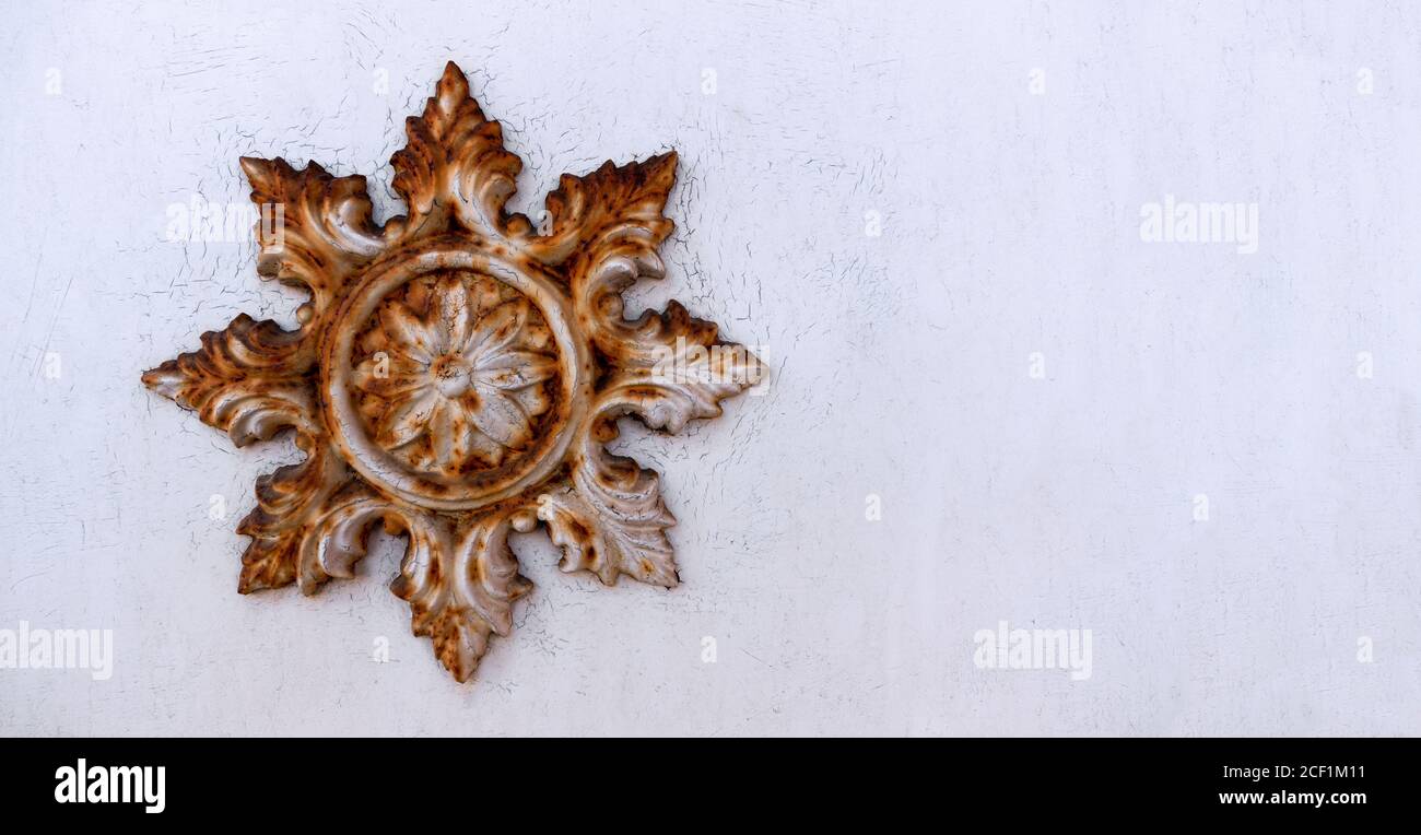 Rusty star on an old white house wall Stock Photo