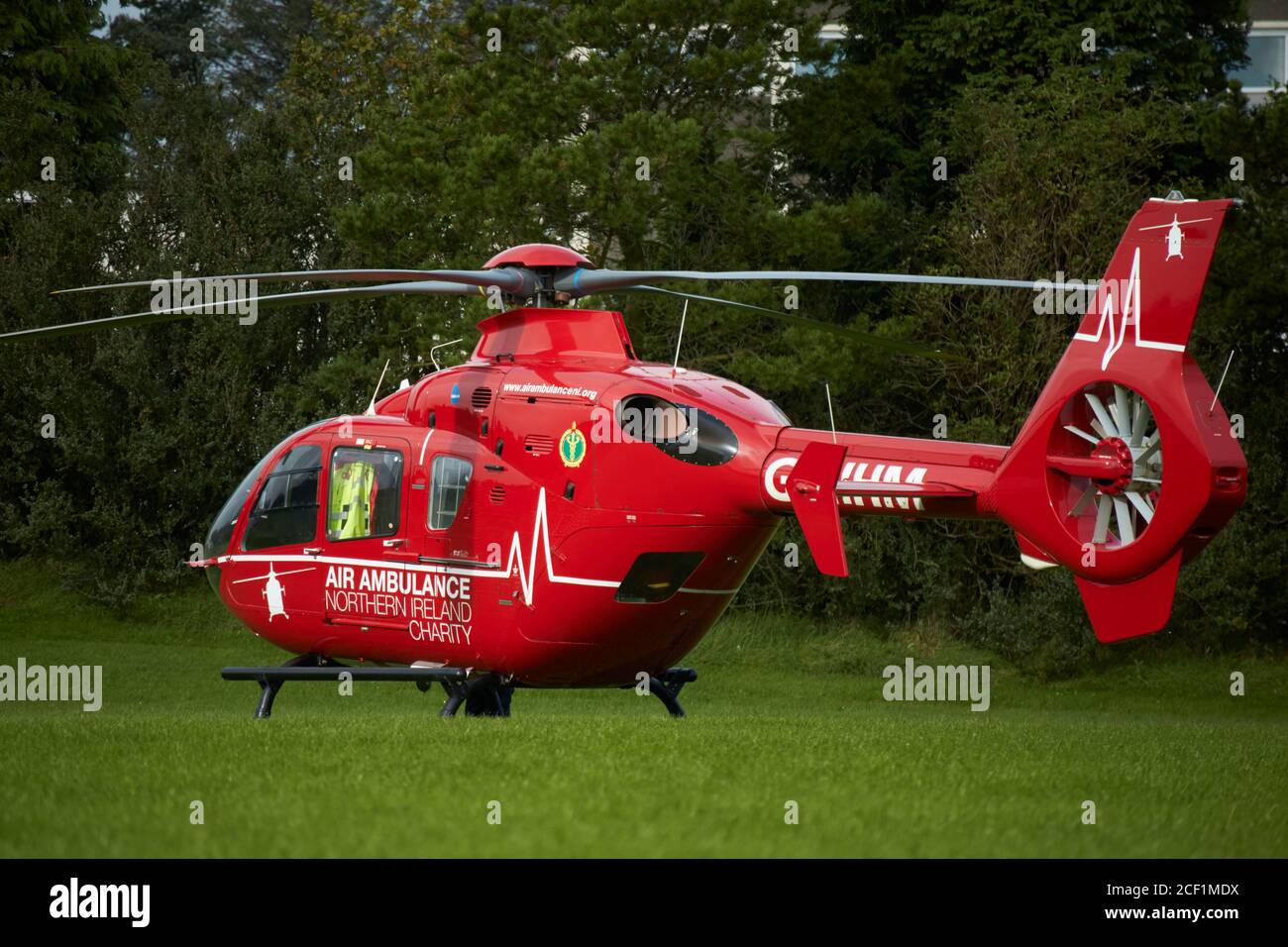 Northern Ireland Air Ambulance on call out landed on a school football pitch in Newtownabbey Northern Ireland UK air ambulance northern ireland ni Stock Photo