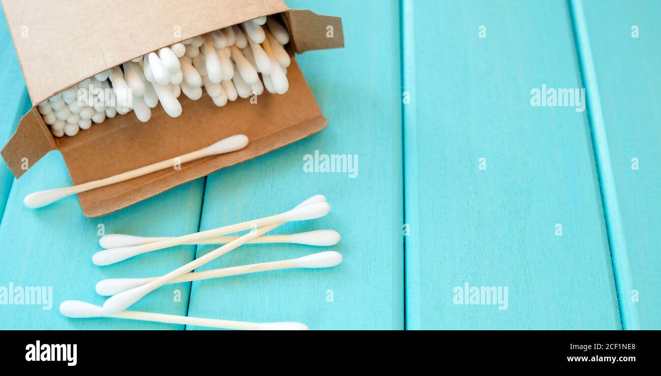 Eco-friendly cosmetic sticks on a turquoise background. Stock Photo