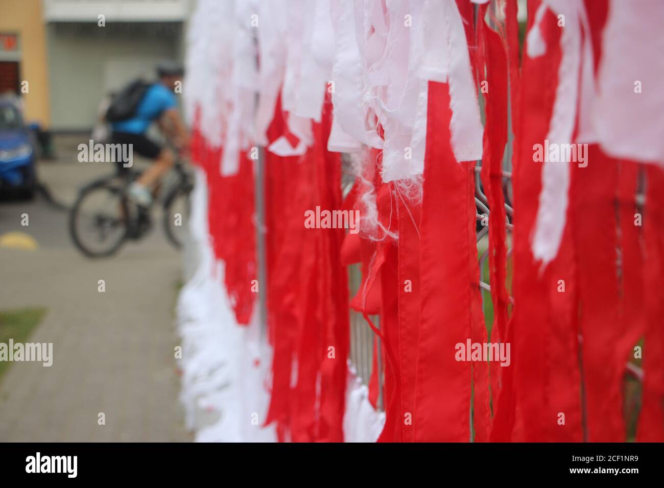 Belarus national flag made of ribbons on fence. Symbol of hope and freedom. Peaceful protest after president elections 2020. Stock Photo