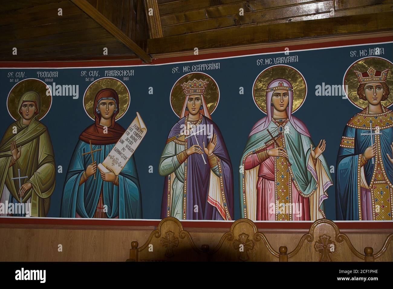 Romania, the interior of a wooden Orthodox church, contemporary icons of holy women. Das Innere einer orthodoxen Holzkirche, Ikonen heiliger Frauen. Stock Photo
