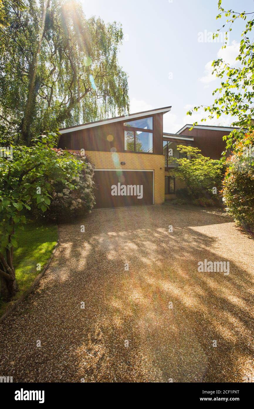 Sunny home exterior and driveway Stock Photo