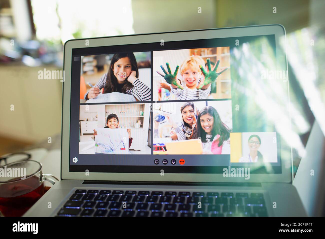 Students and teacher e-learning on laptop screen Stock Photo