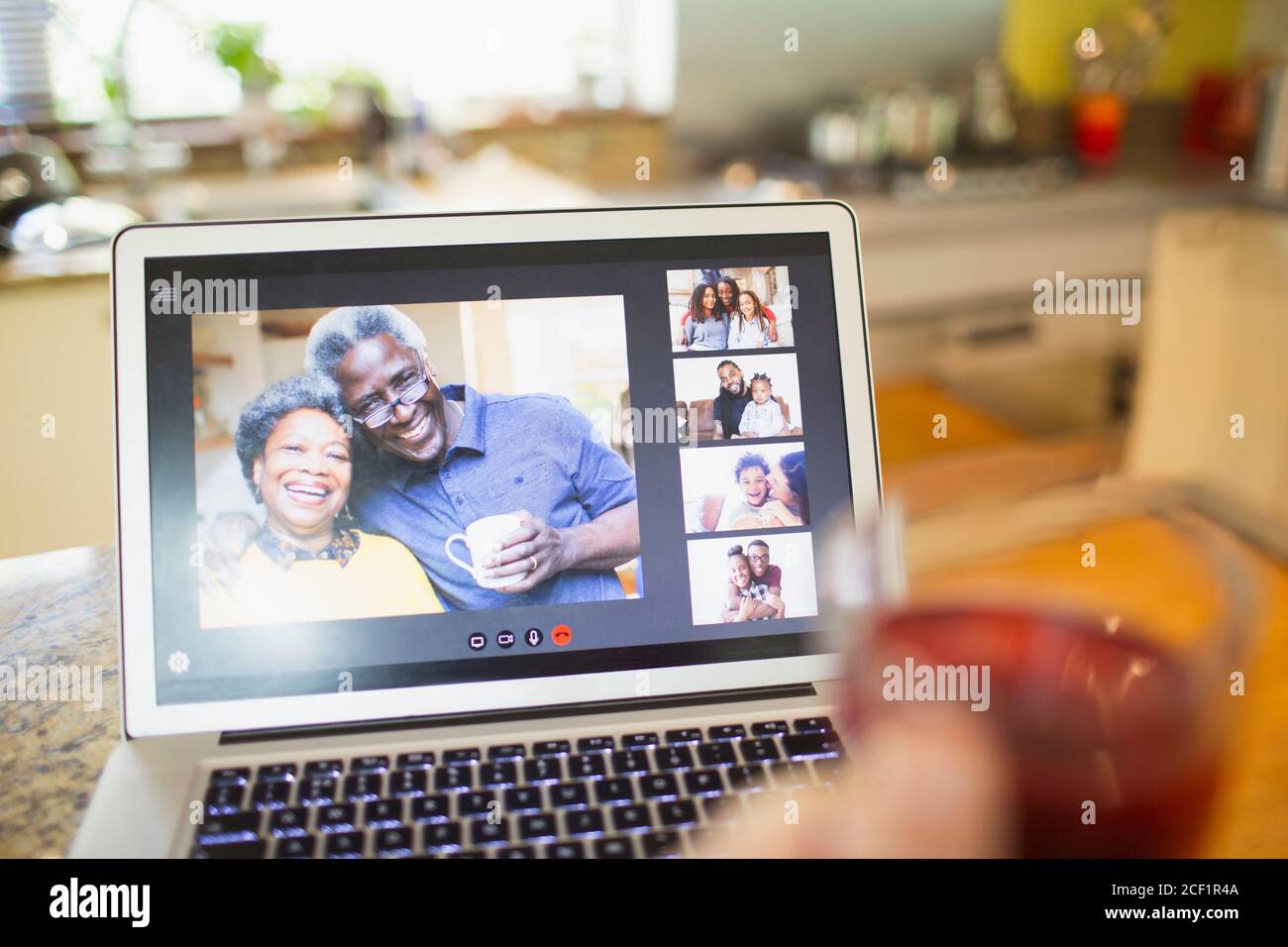 POV Friends video conferencing on laptop screen Stock Photo