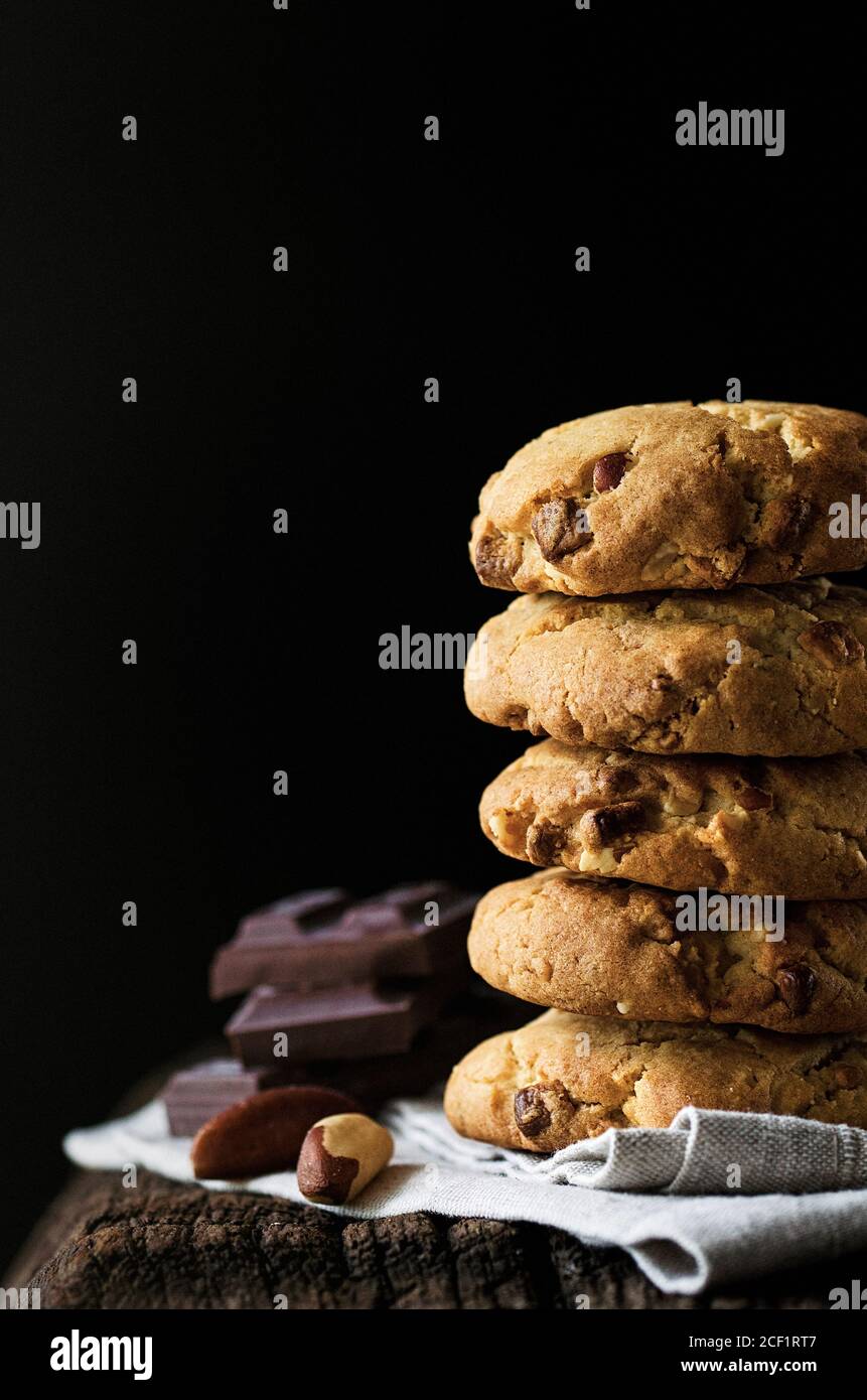 Stack of chocolate chip cookies with Brazil nuts Stock Photo