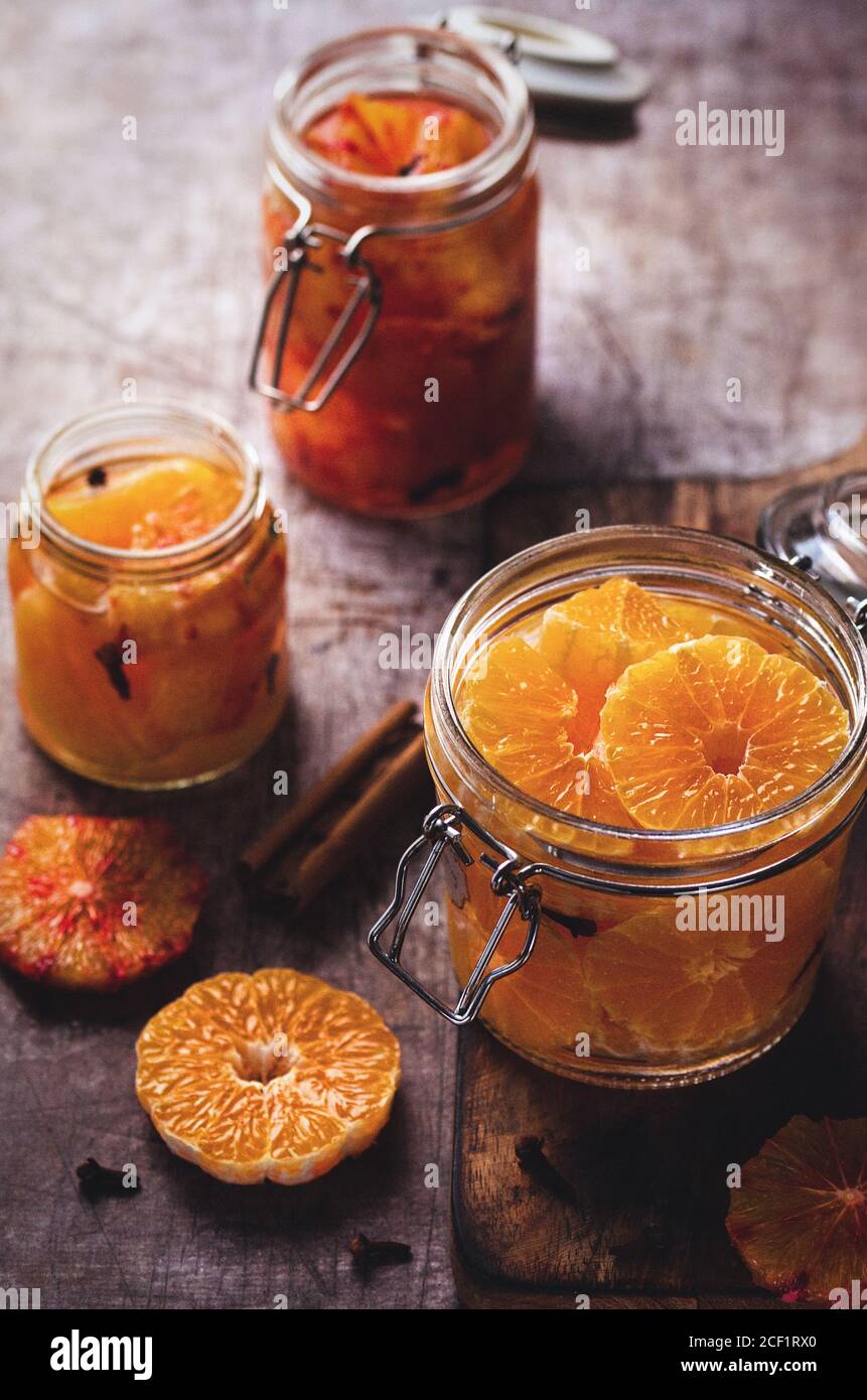 Preserved clementine and blood orange slices in jars Stock Photo