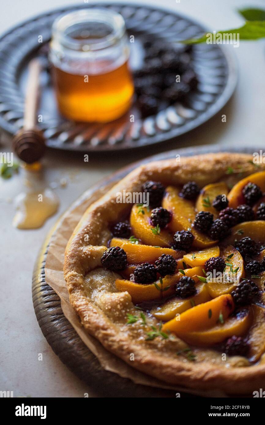 Peach blackberry honey galette Stock Photo