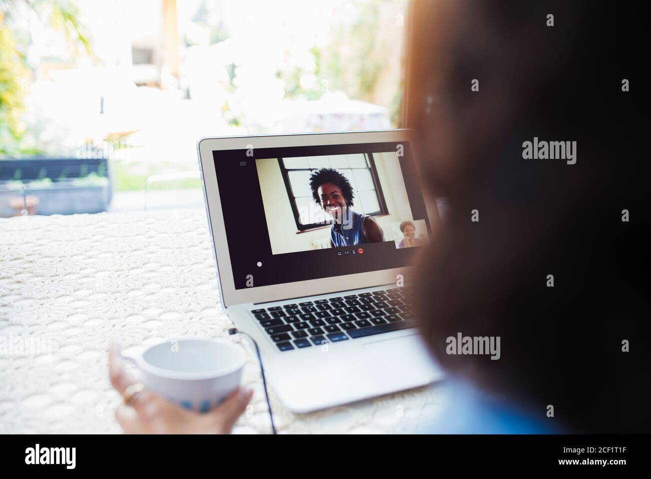 Women video conferencing on laptop screen Stock Photo