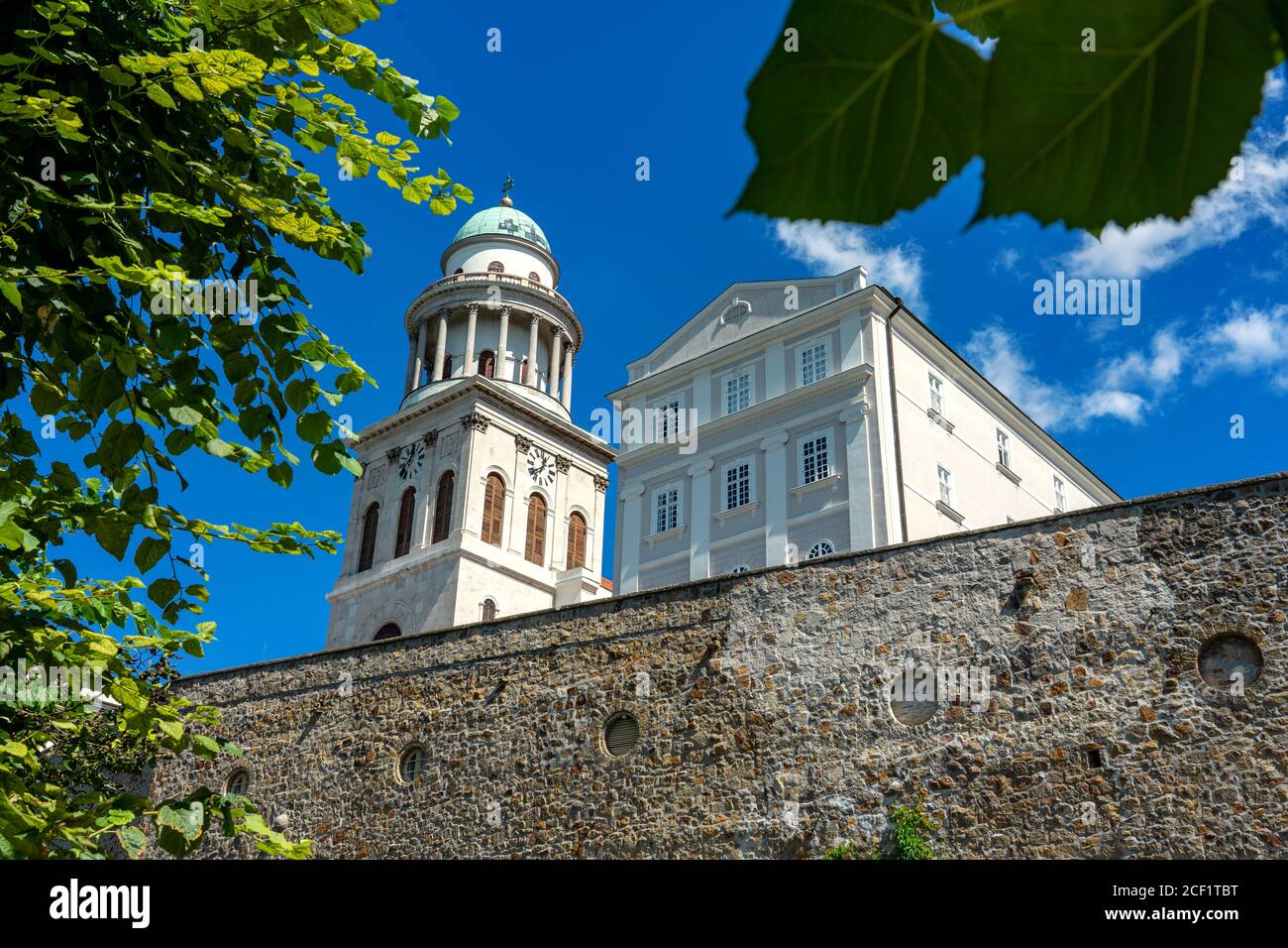 Pannonhalma arch abbey detail with trees around it Stock Photo