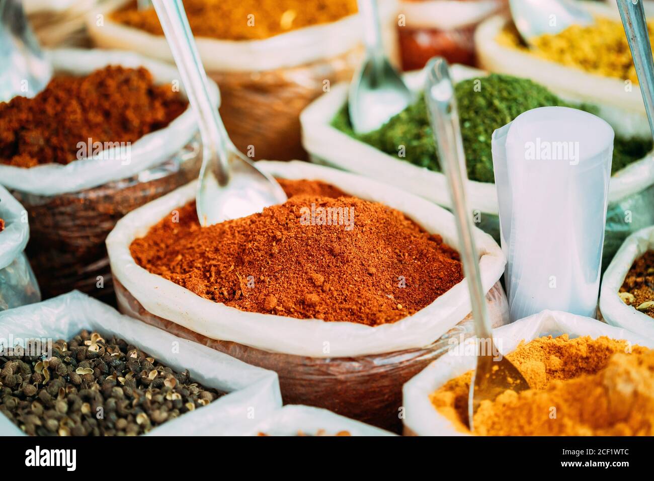 Close View Of Masala Curry, Bright Colors Fragrant Seasoning, Condiment In Bags On Local Food Market, Bazaar. Stock Photo