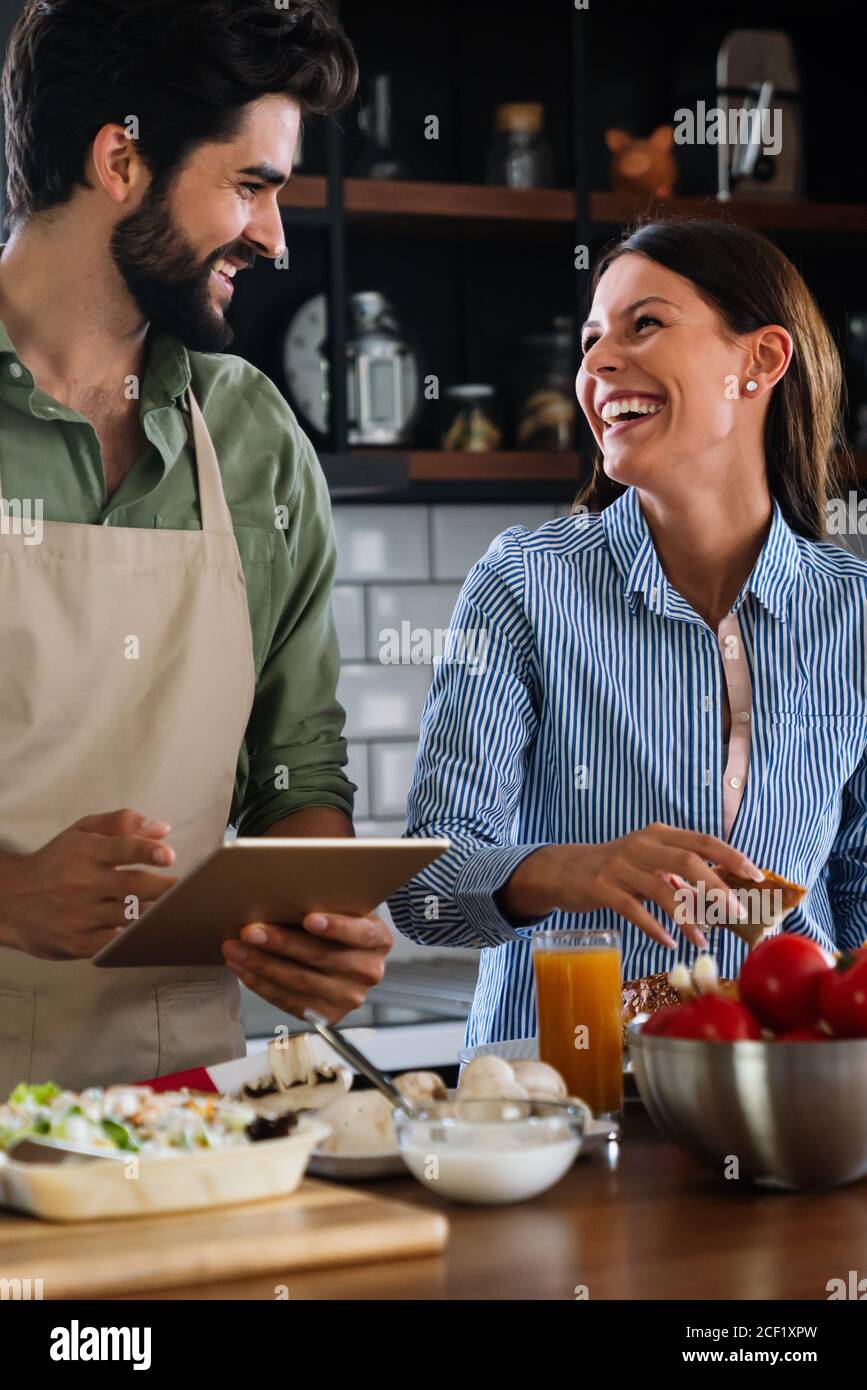 Couple cooking food happiness hobby liefstyle concept Stock Photo - Alamy