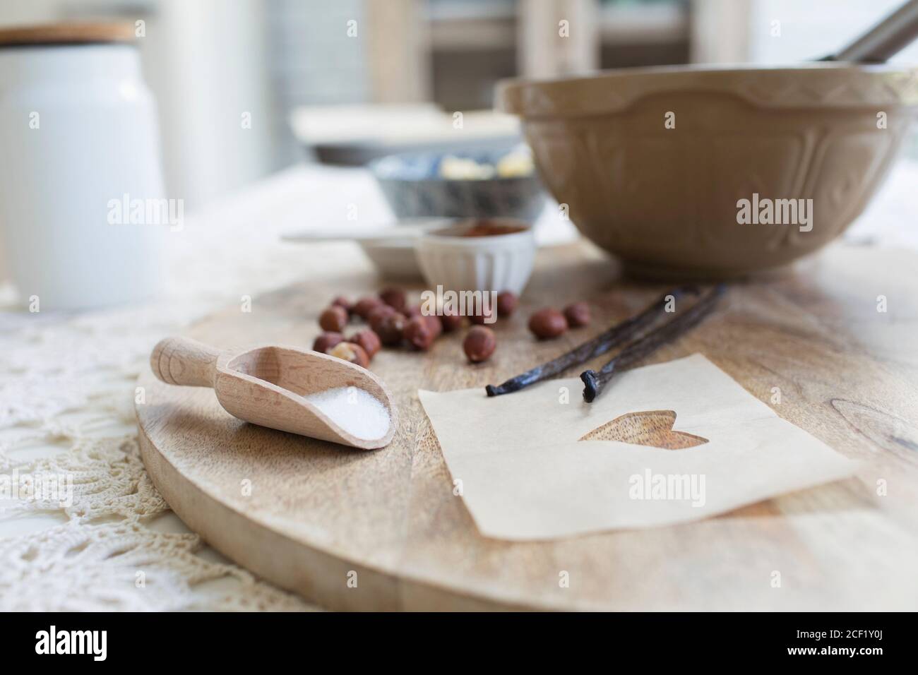 Close up heart and baking ingredients on cutting board Stock Photo
