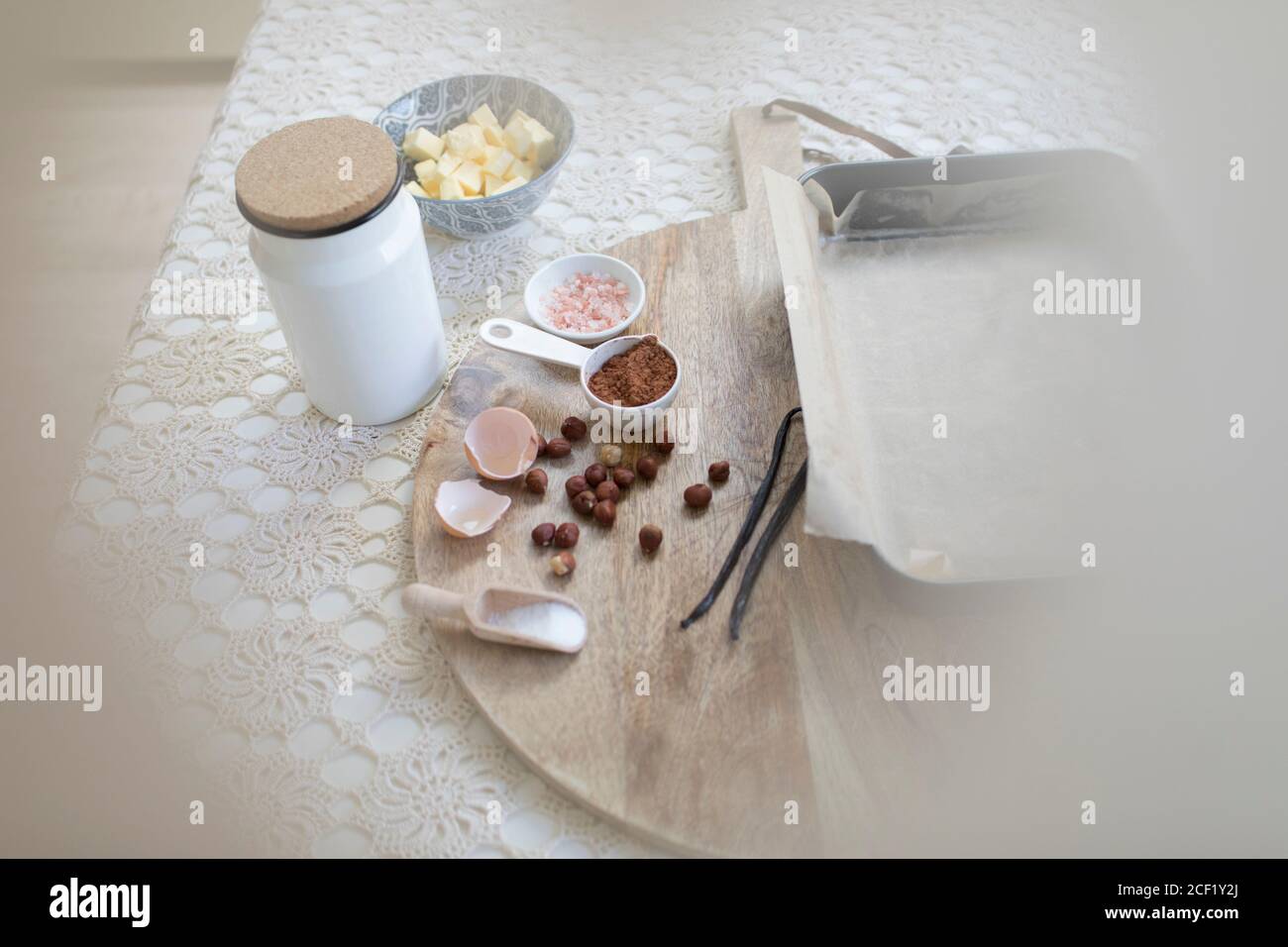 Baking ingredients on cutting board and table Stock Photo