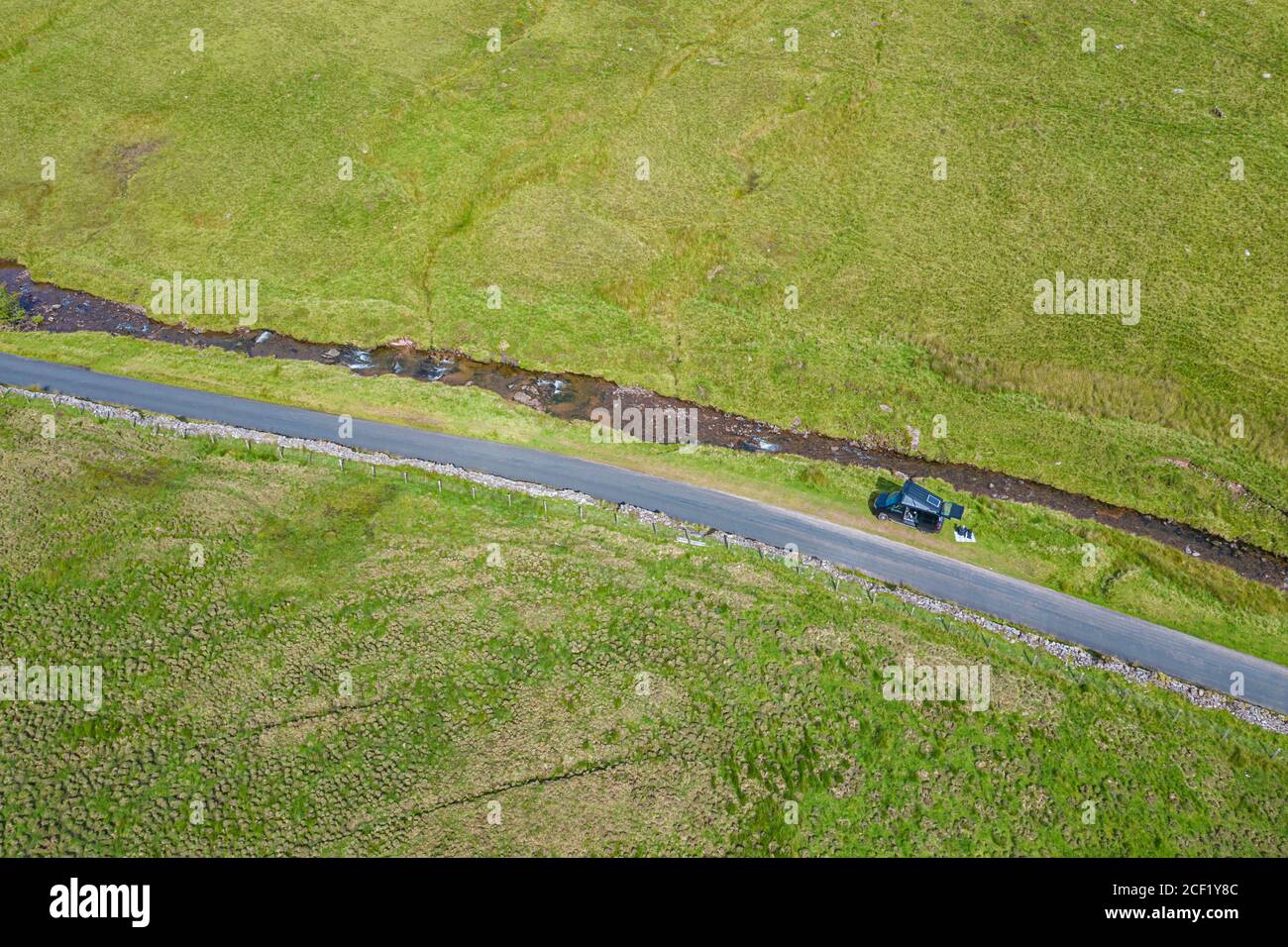 Drone View of a Camper Van parked up by river Stock Photo