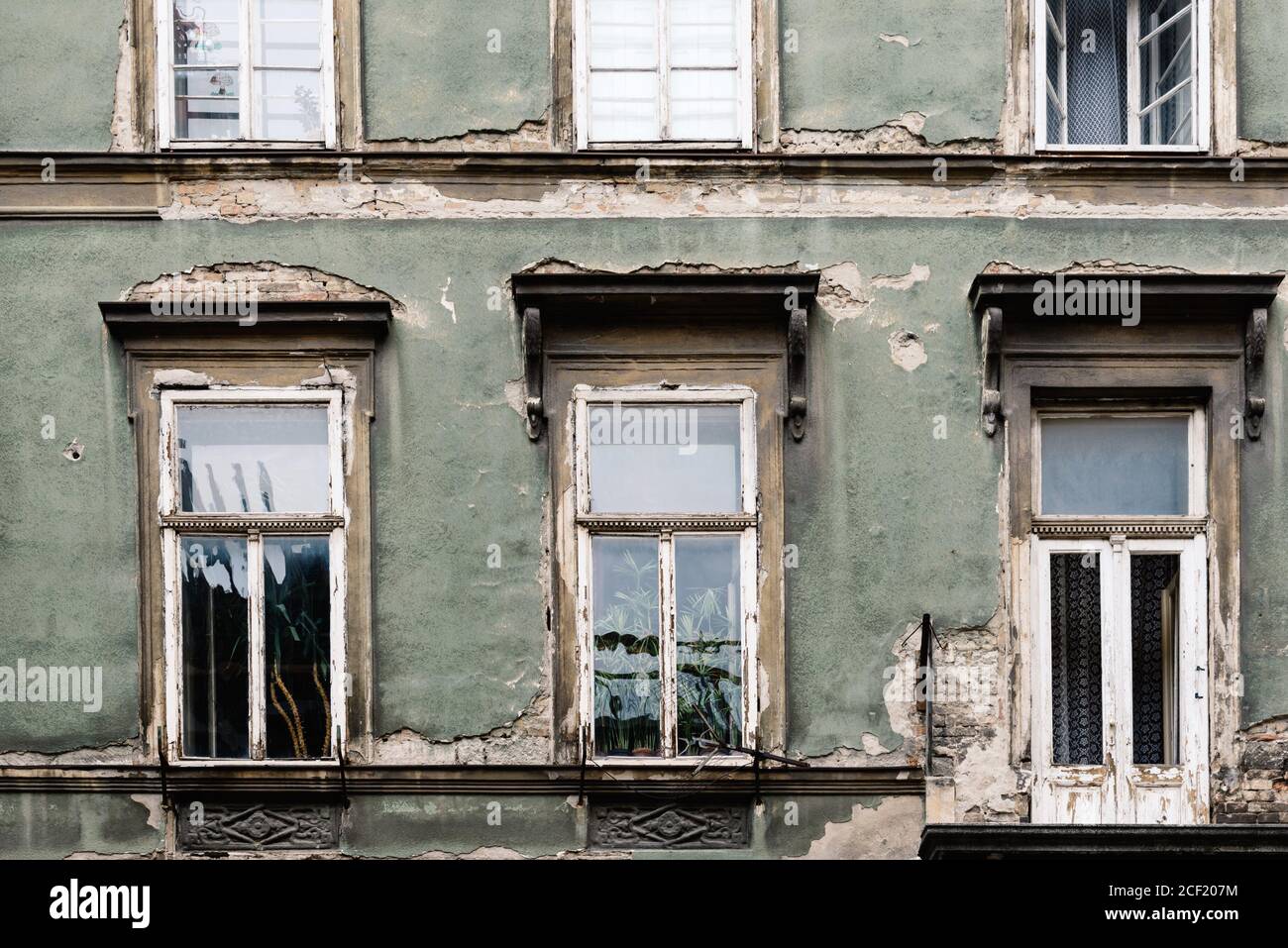 Detail of aged old building facade. Pattern of windows. Stock Photo