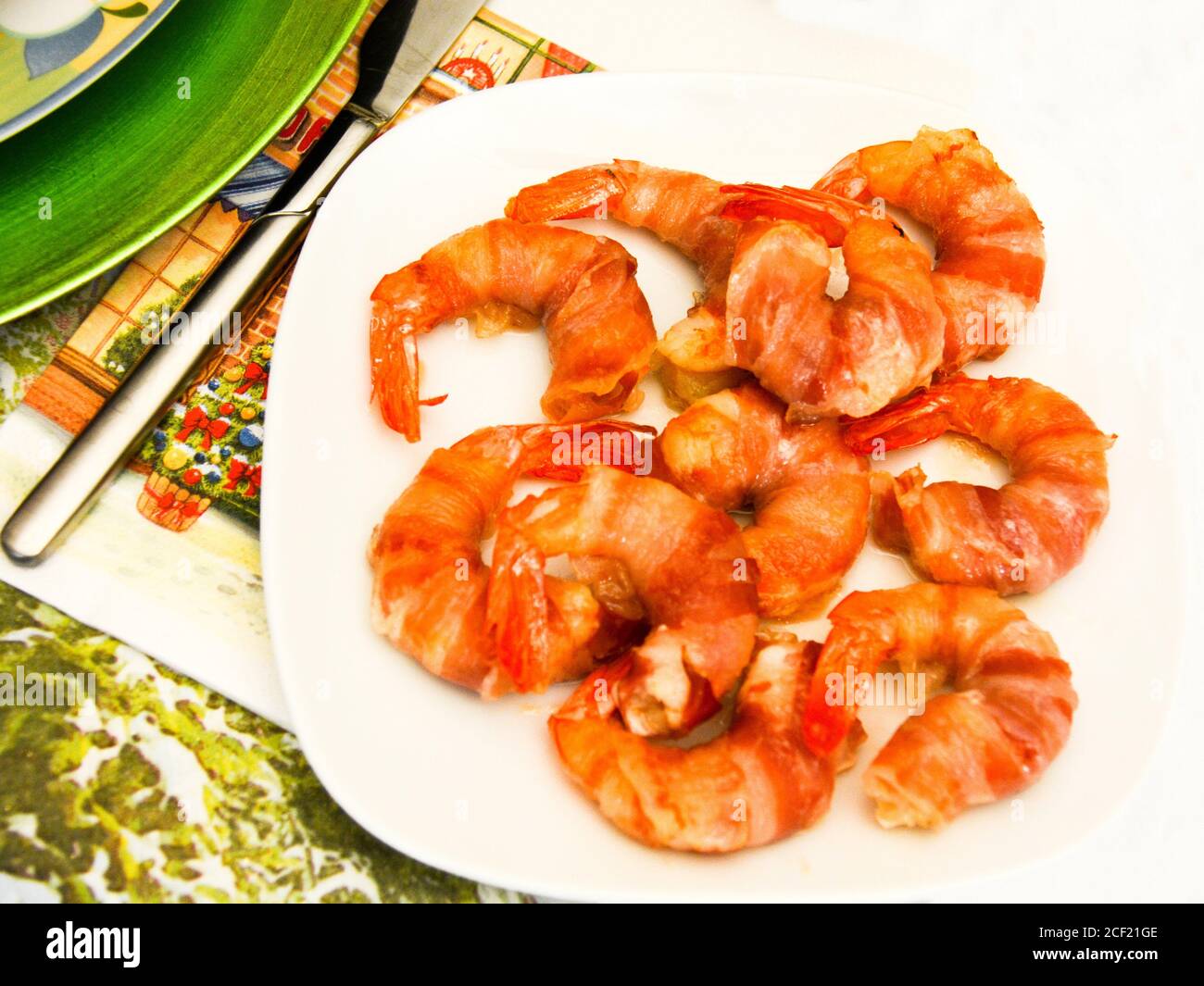 finger food with shrimps and bacon. Stock Photo