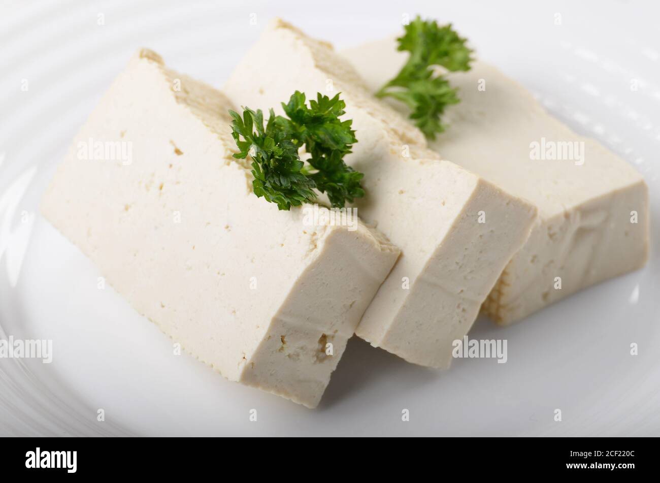 Soy Bean curd tofu on clay dish closeup. Nondairy alternative
