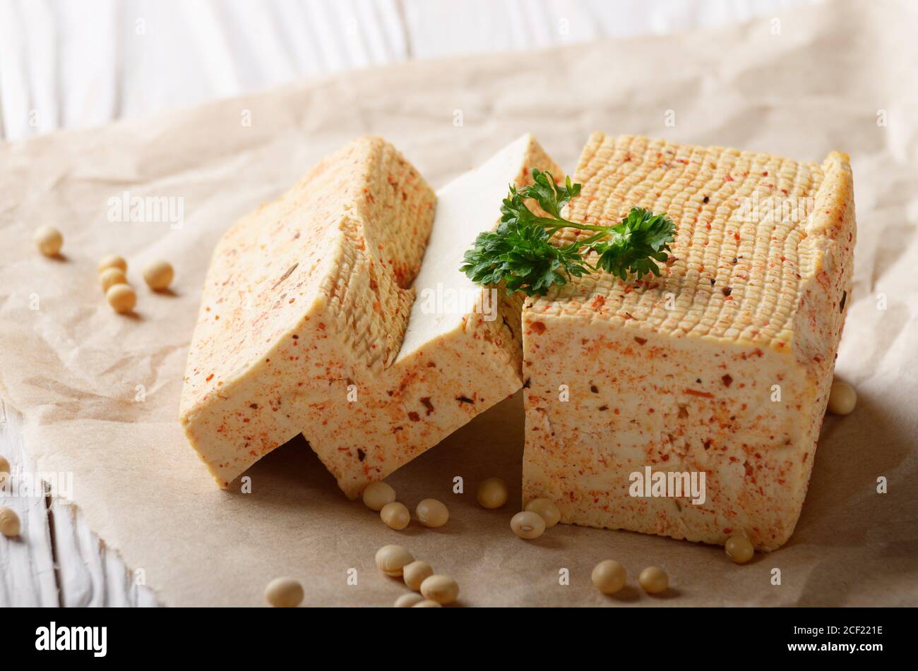 soy-bean-curd-tofu-on-parchment-paper-with-greens-non-dairy-alternative