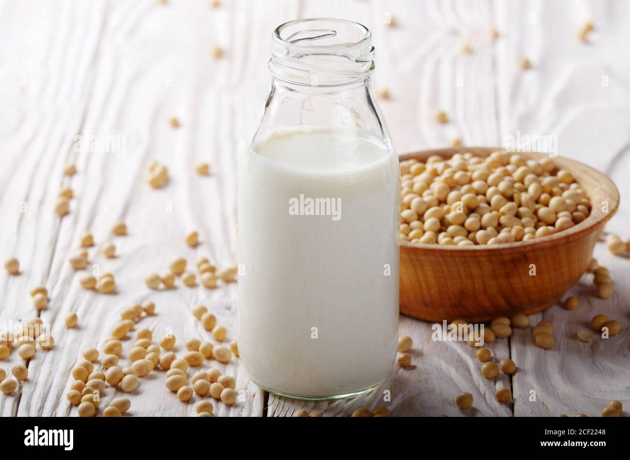 Nondairy alternative Soy milk or yogurt in glass bottle on white