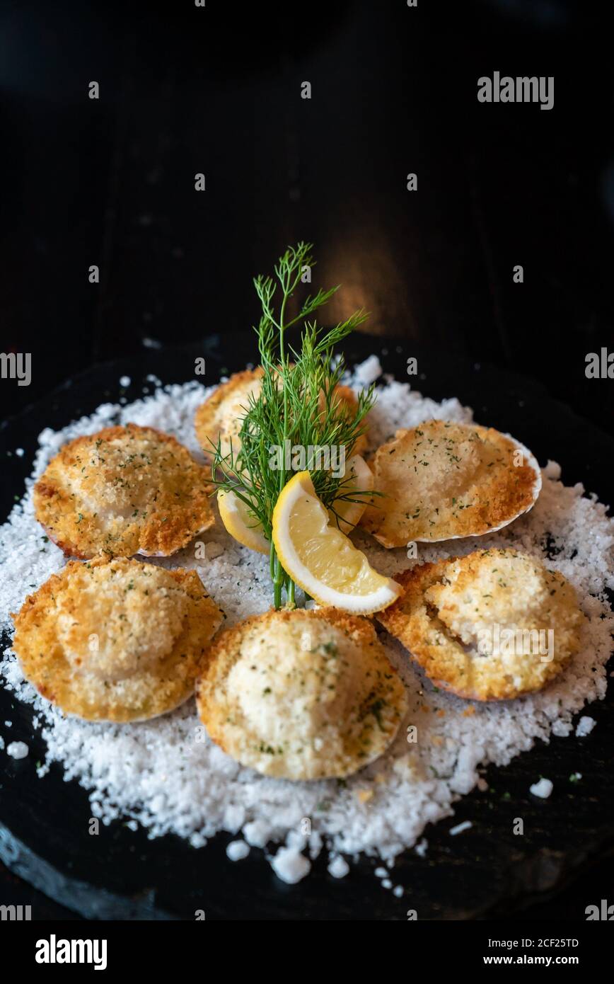 deep fried Hokkaido Scallops Shell with crusty bread serve with lemon