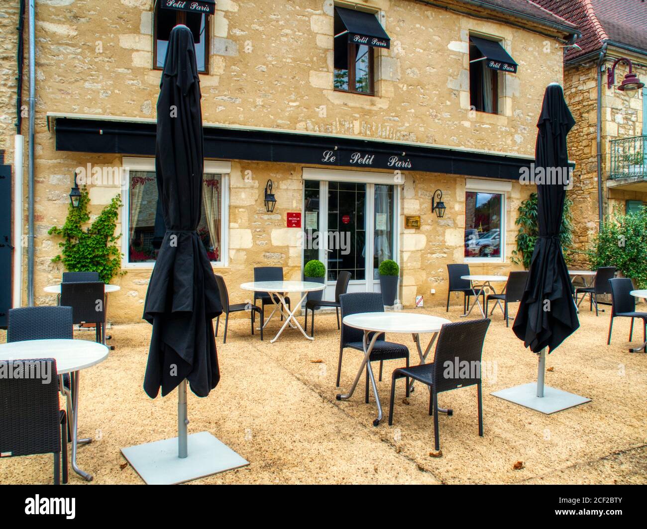 outdoor tables at Le Petit Paris restaurant, Daglan, dordogne Department, Nouvelle Aquitaine