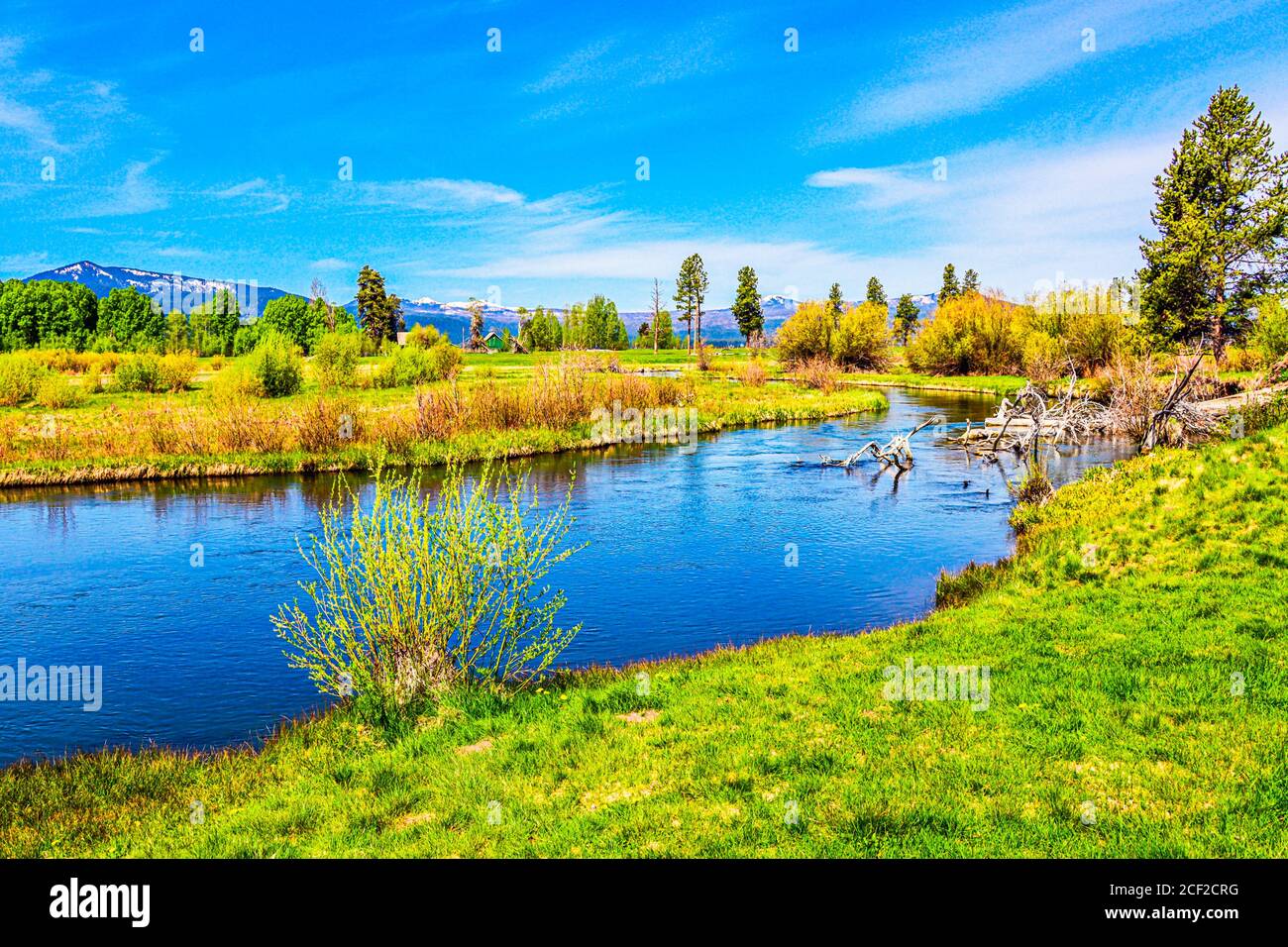 Wood River, southern Oregon. Snow capped mountains of the Cascade Range in the distance. Stock Photo