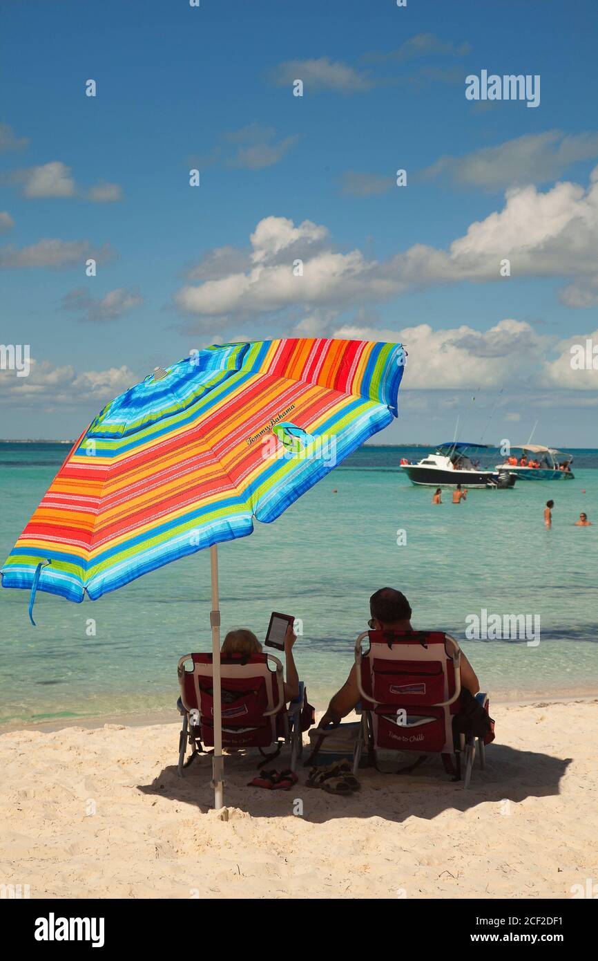 People sunbathing at the sandy beach, Isla Mujeres, Cancun, Quintana Roo, Mexico, Central America. Stock Photo