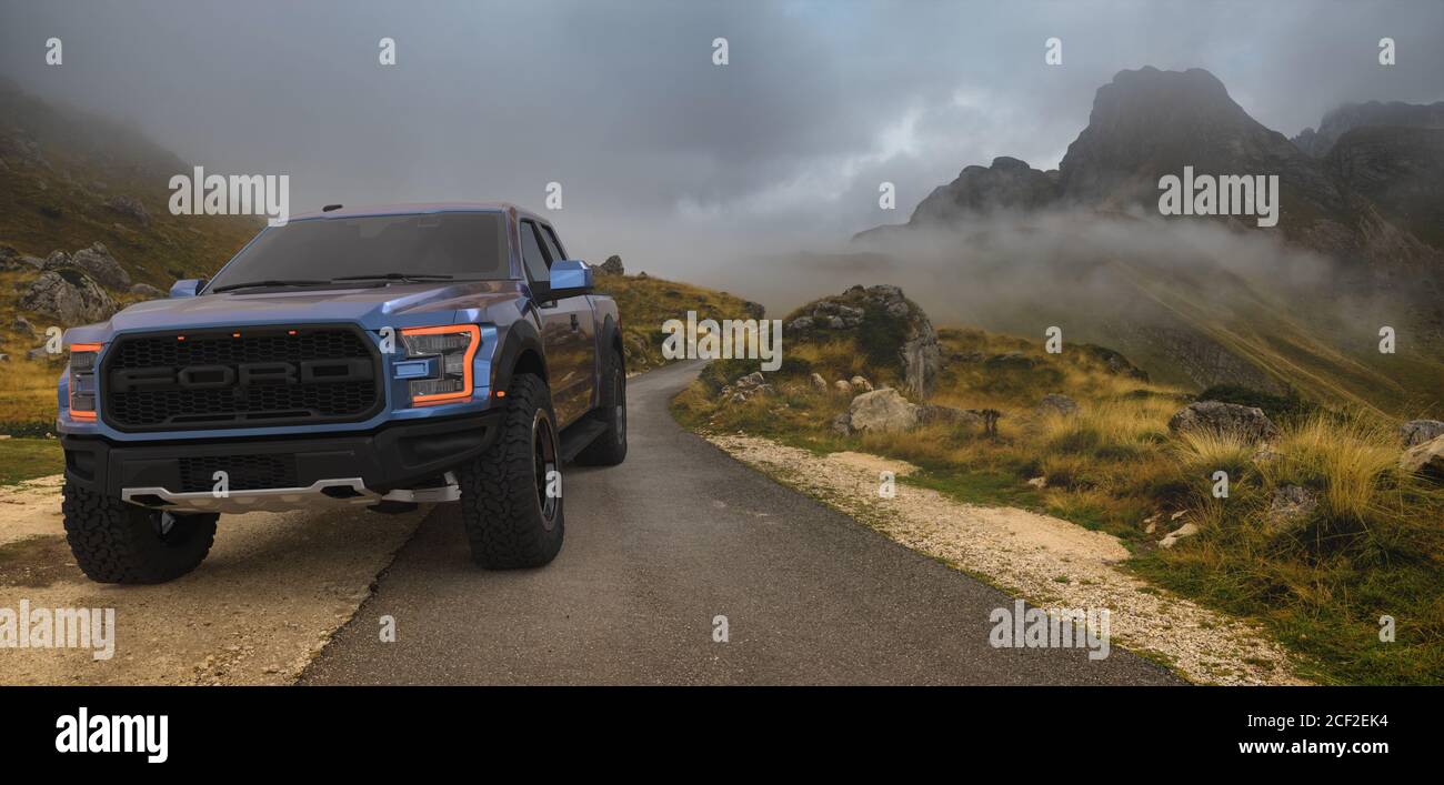 Ford F-150 Raptor with a mountain landscape in the background Stock Photo