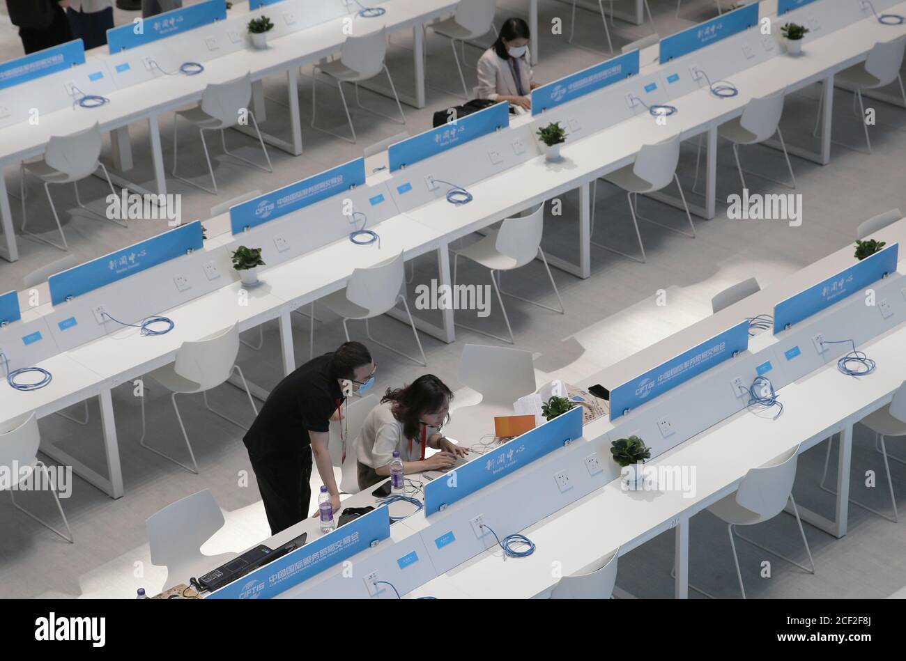 Beijing, China. 3rd Sep, 2020. Journalists work at the media center of China International Fair for Trade in Services (CIFTIS) in Beijing, capital of China, Sept. 3, 2020. The media center of the CIFTIS started trial operation on Thursday. The CIFTIS is to be held from Sept. 4 to 9. Credit: Pan Siwei/Xinhua/Alamy Live News Stock Photo