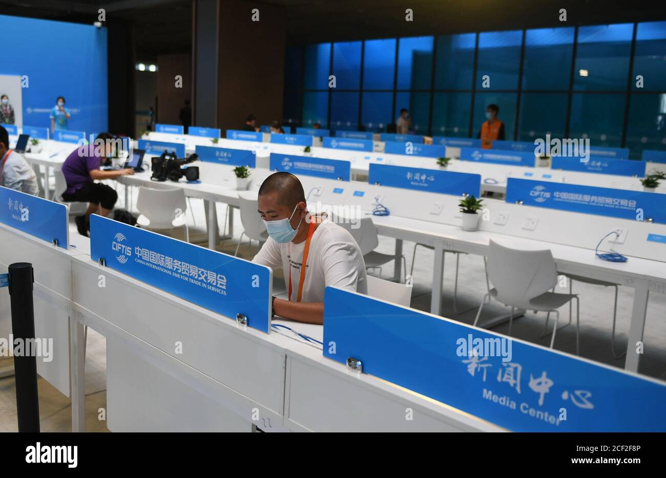 Beijing, China. 3rd Sep, 2020. Journalists work at the media center of the China International Fair for Trade in Services (CIFTIS) in Beijing, capital of China, Sept. 3, 2020. The media center of the CIFTIS started trial operation on Thursday. The CIFTIS is to be held from Sept. 4 to 9. Credit: Lu Peng/Xinhua/Alamy Live News Stock Photo
