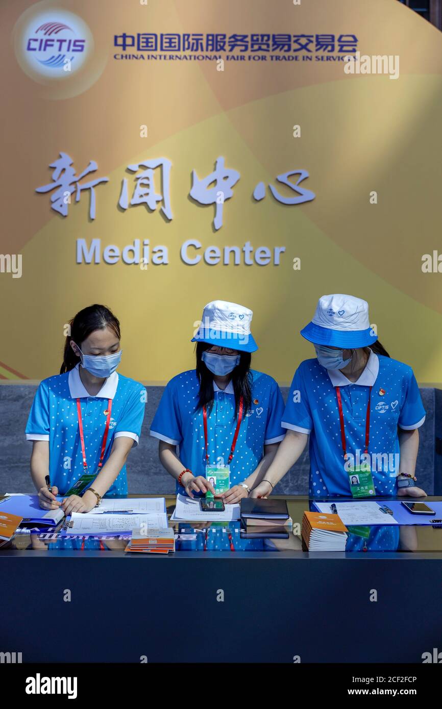 Beijing, China. 3rd Sep, 2020. Volunteers work at the media center of the China International Fair for Trade in Services (CIFTIS) in Beijing, capital of China, Sept. 3, 2020. The media center of the CIFTIS started trial operation on Thursday. The CIFTIS is to be held from Sept. 4 to 9. Credit: Li Muzi/Xinhua/Alamy Live News Stock Photo