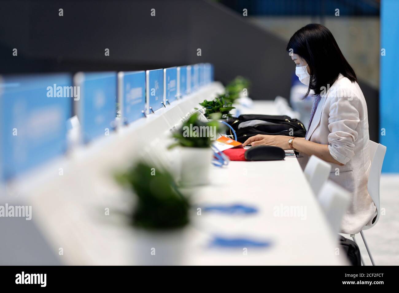 Beijing, China. 3rd Sep, 2020. A journalist works at the media center of China International Fair for Trade in Services (CIFTIS) in Beijing, capital of China, Sept. 3, 2020. The media center of the CIFTIS started trial operation on Thursday. The CIFTIS is to be held from Sept. 4 to 9. Credit: Li Muzi/Xinhua/Alamy Live News Stock Photo