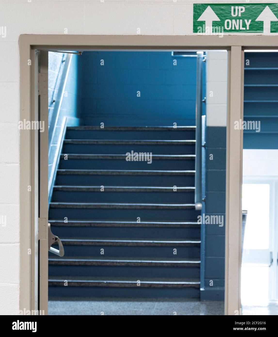 To help get back to in person teaching a high school has arrainged up and down only staircases and one way halls to help the students stay six feet ap Stock Photo