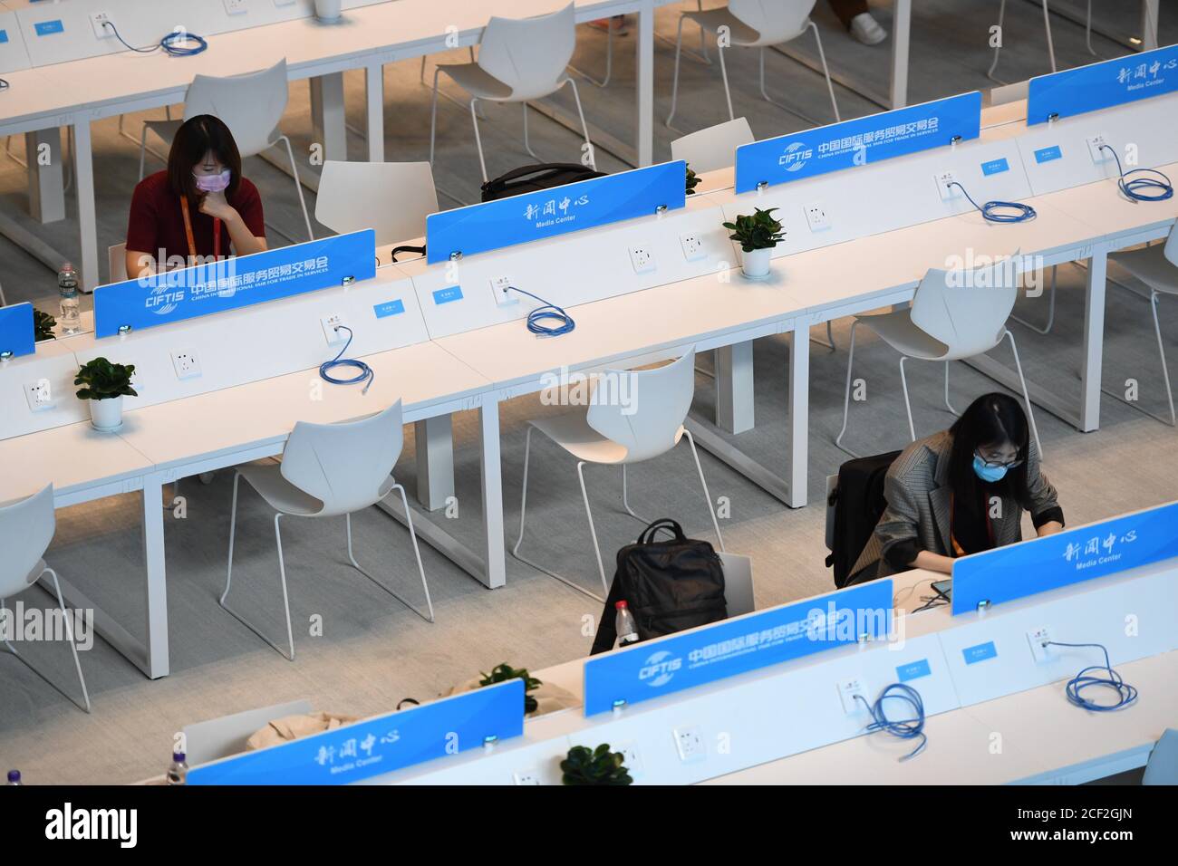 Beijing, China. 3rd Sep, 2020. Journalists work at the media center of the China International Fair for Trade in Services (CIFTIS) in Beijing, capital of China, Sept. 3, 2020. The media center of the CIFTIS started trial operation on Thursday. The CIFTIS is to be held from Sept. 4 to 9. Credit: Ju Huanzong/Xinhua/Alamy Live News Stock Photo