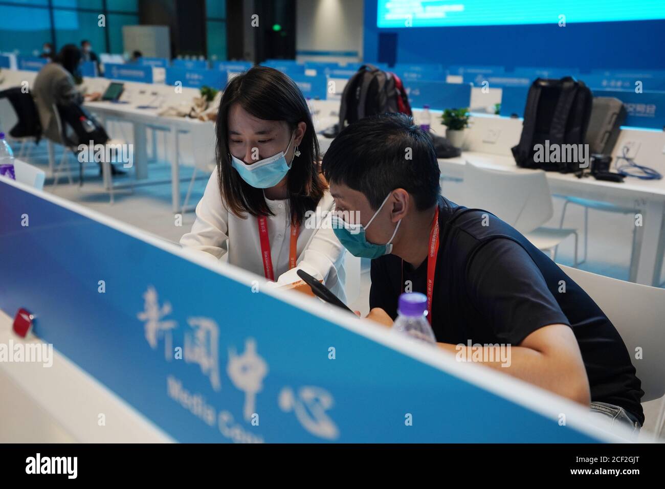 Beijing, China. 3rd Sep, 2020. Journalists work at the media center of the China International Fair for Trade in Services (CIFTIS) in Beijing, capital of China, Sept. 3, 2020. The media center of the CIFTIS started trial operation on Thursday. The CIFTIS is to be held from Sept. 4 to 9. Credit: Ju Huanzong/Xinhua/Alamy Live News Stock Photo