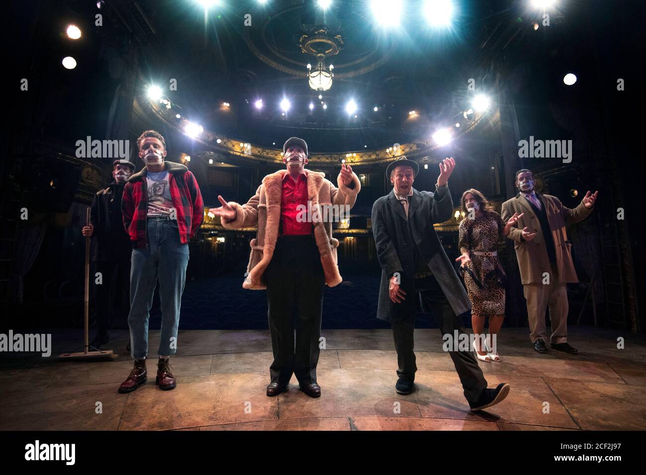 The cast of Only Fools and Horses The Musical on stage of the Theatre Royal Haymarket in London, after observing a 15 minute socially-distanced silence outside to show solidarity with those in the theatre industry who have lost their jobs due to the coronavirus pandemic. Stock Photo