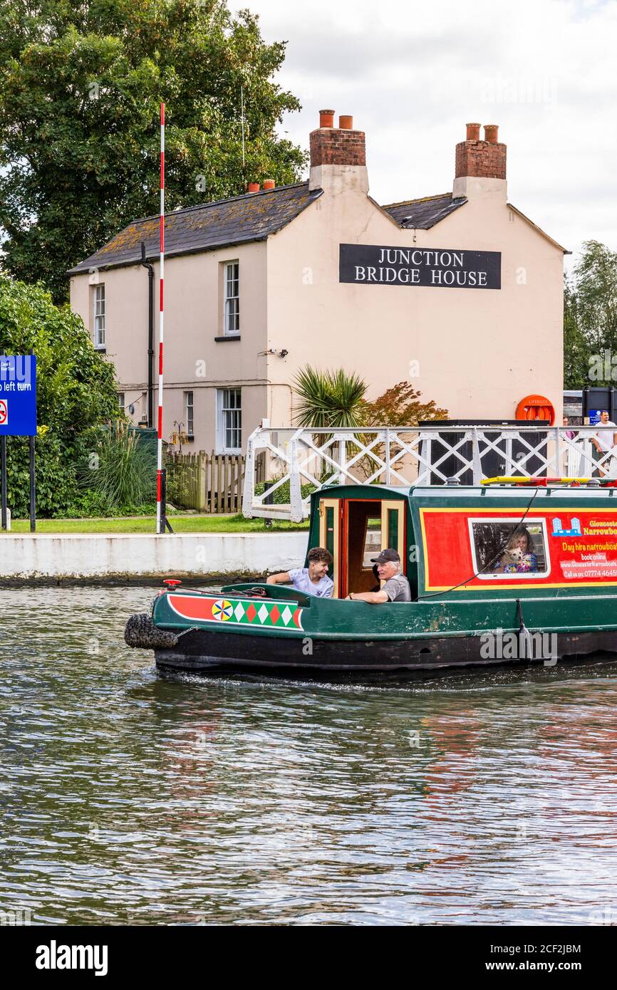 Narrow boat on Gloucester and Sharpness Canal passing Junction Bridge House at Saul Junction with the Stroudwater Navigation, Saul, Gloucestershire UK Stock Photo