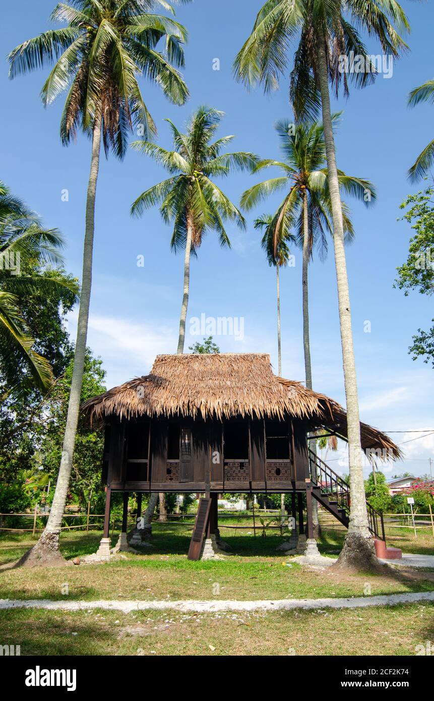 Malays wooden house in coconut farm at Kampung Agong, Penang. Blue