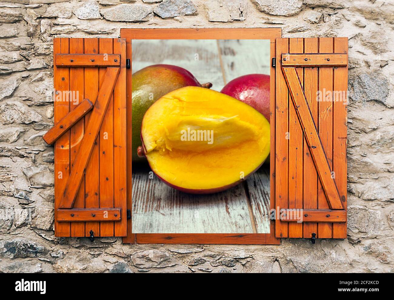 Mangoes in rustic background. It´s a point of view from the window in a ...